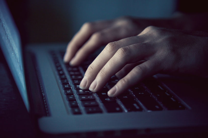 Hands typing on a keyboard Hands typing on a keyboard